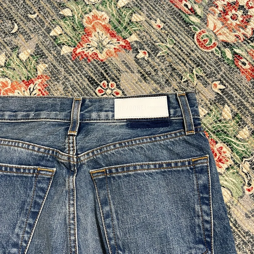 Re Done high rise stove pipe raw frayed hem denim jeans